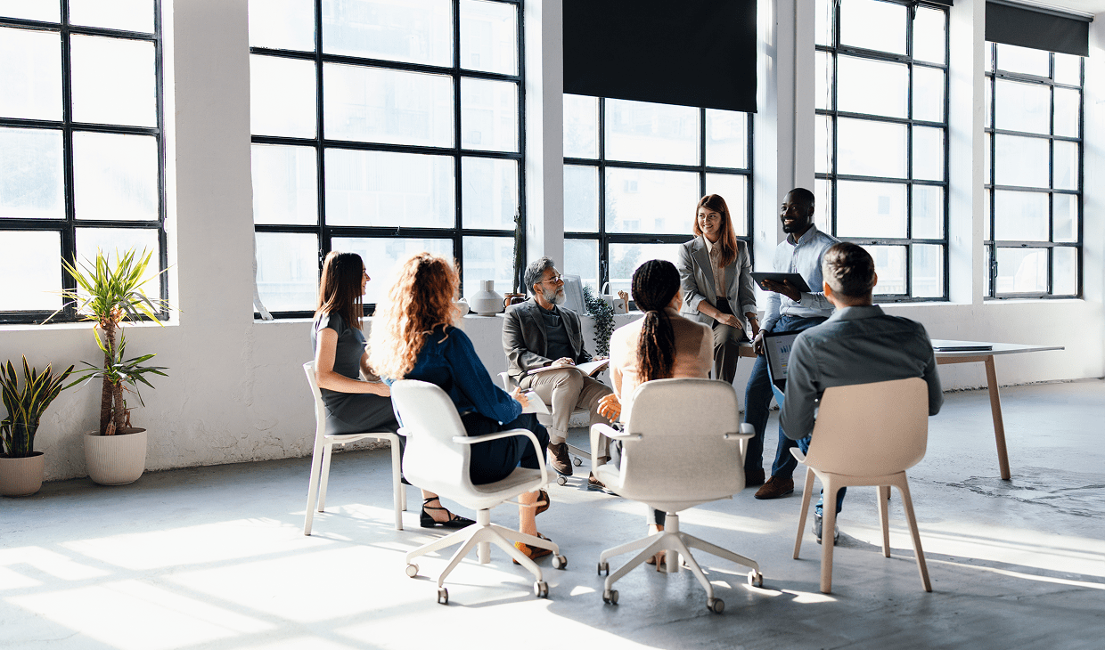 Colleagues collaborating in open-plan office
