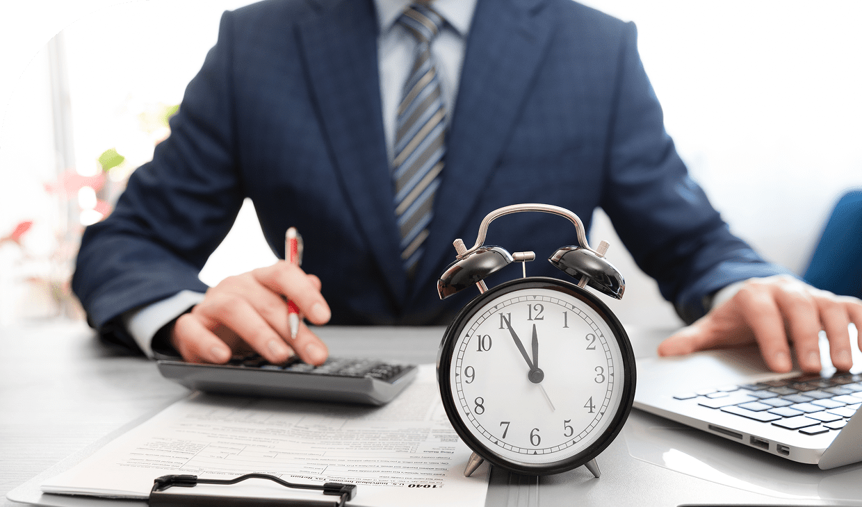 Office desk with clock and documents