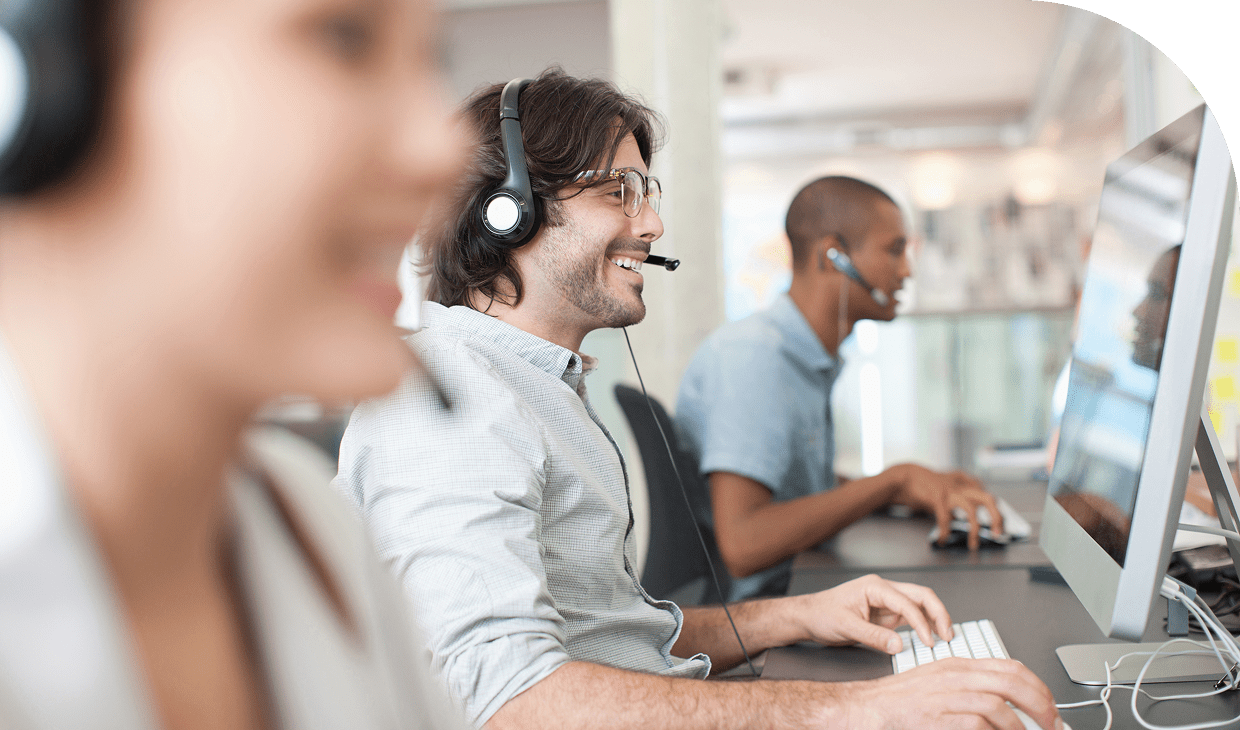 Call center team working on computers