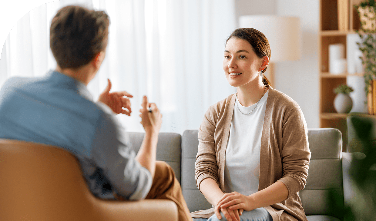 Casual meeting between two seated individuals.
