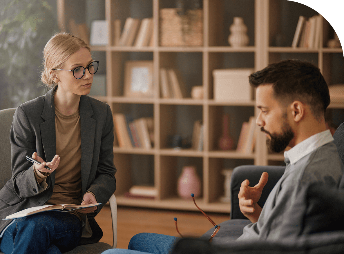 Woman counseling man in office setting