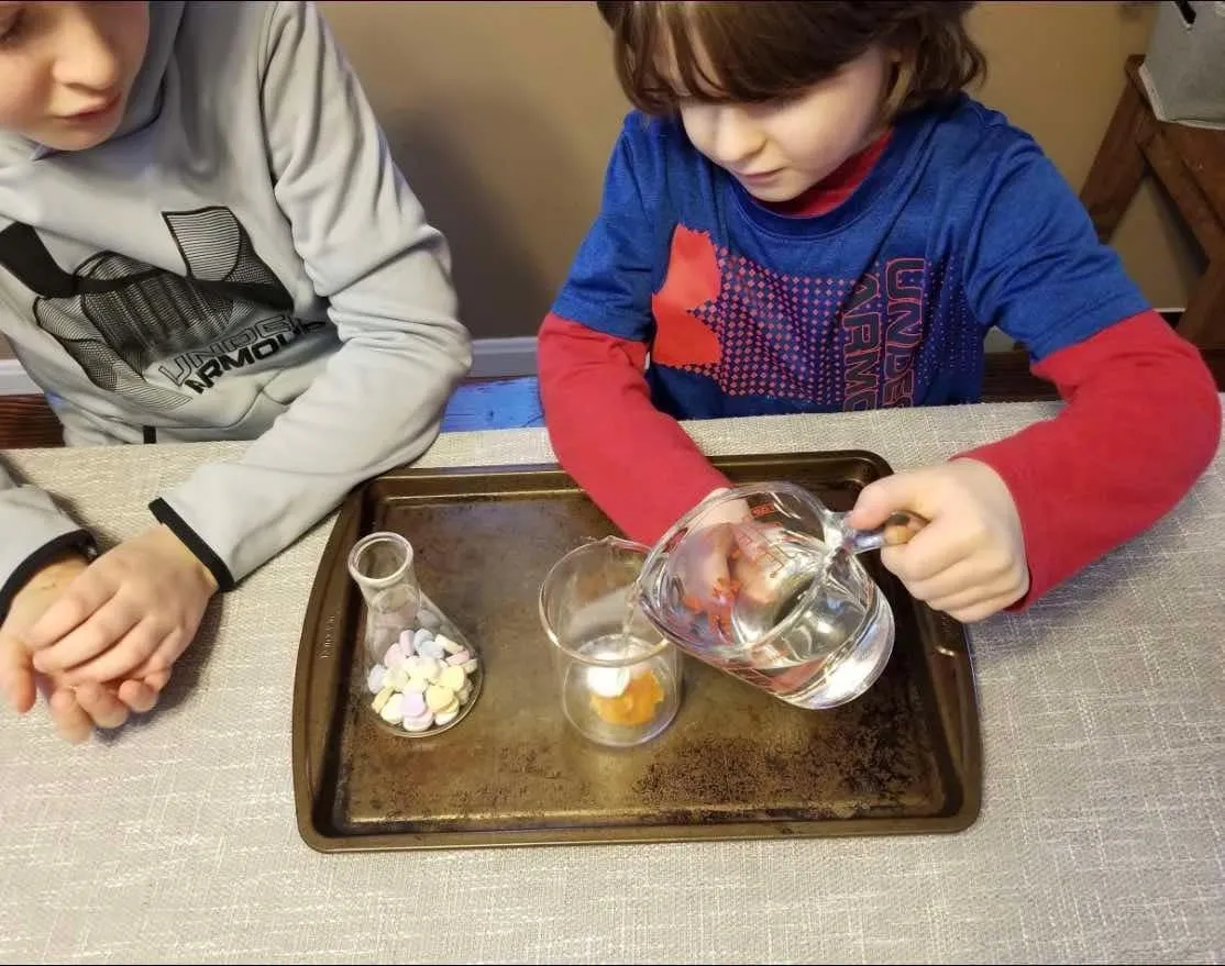 Children conducting a science experiment with water